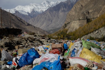 caption: Trash from an informal dump in far northern Pakistan is frequently incinerated, sending up plumes of foul-smelling smoke right near a glacial lake frequented by tourists.