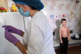caption: A nurse prepares a syringe for a vaccination against measles at a pediatric clinic in Kiev. The Ukraine had 72,408 cases of measles in the year from March 2018 to February 2019 — the highest number for any country during that period.