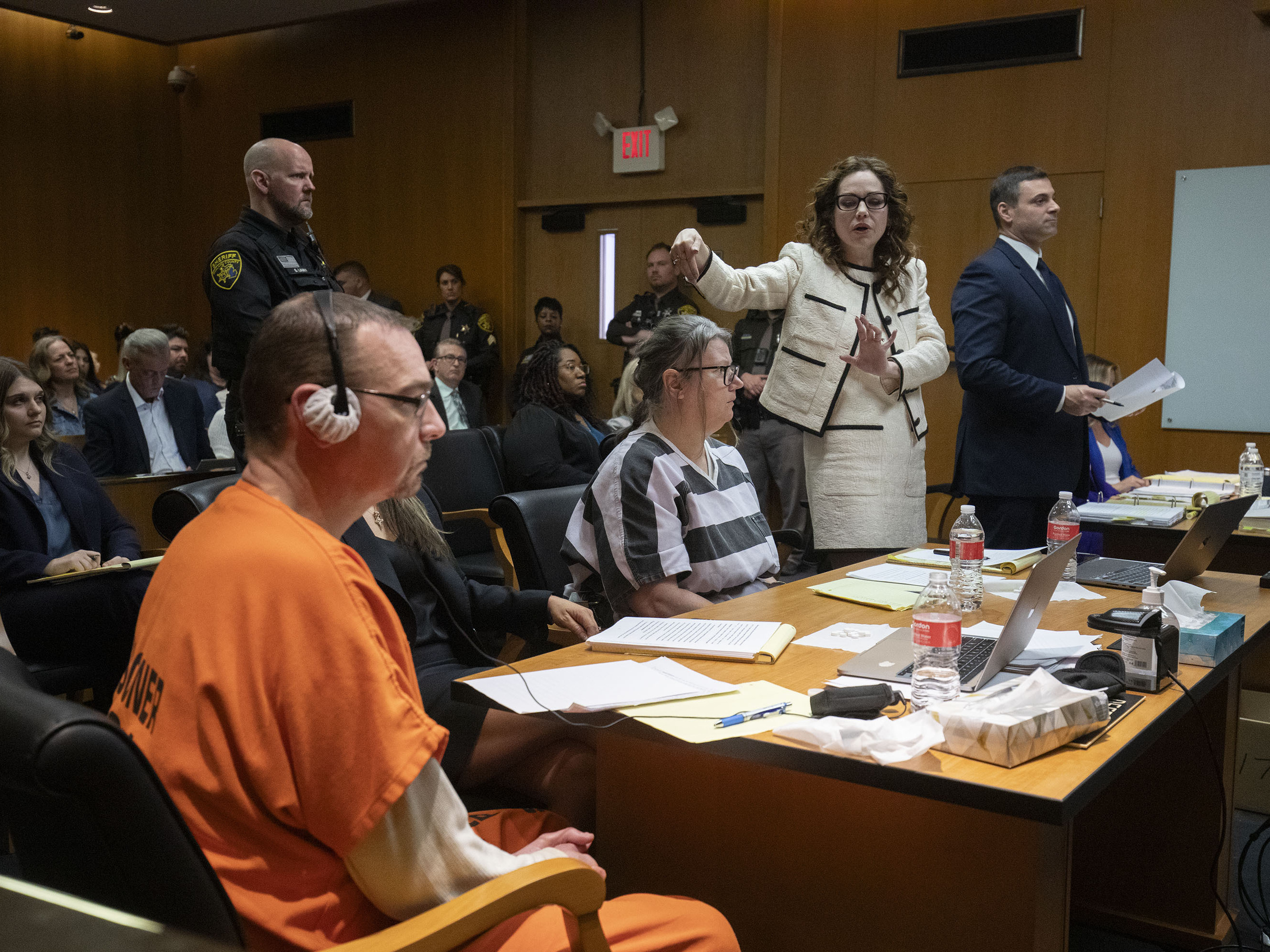 caption: (From left) James Crumbley, his attorney Mariell Lehman, Jennifer Crumbley and her attorney Shannon Smith sit in court in Pontiac, Mich., for Tuesday's sentencing on four counts of involuntary manslaughter for the deaths of four Oxford High School students who were shot and killed by the Crumbleys' son.