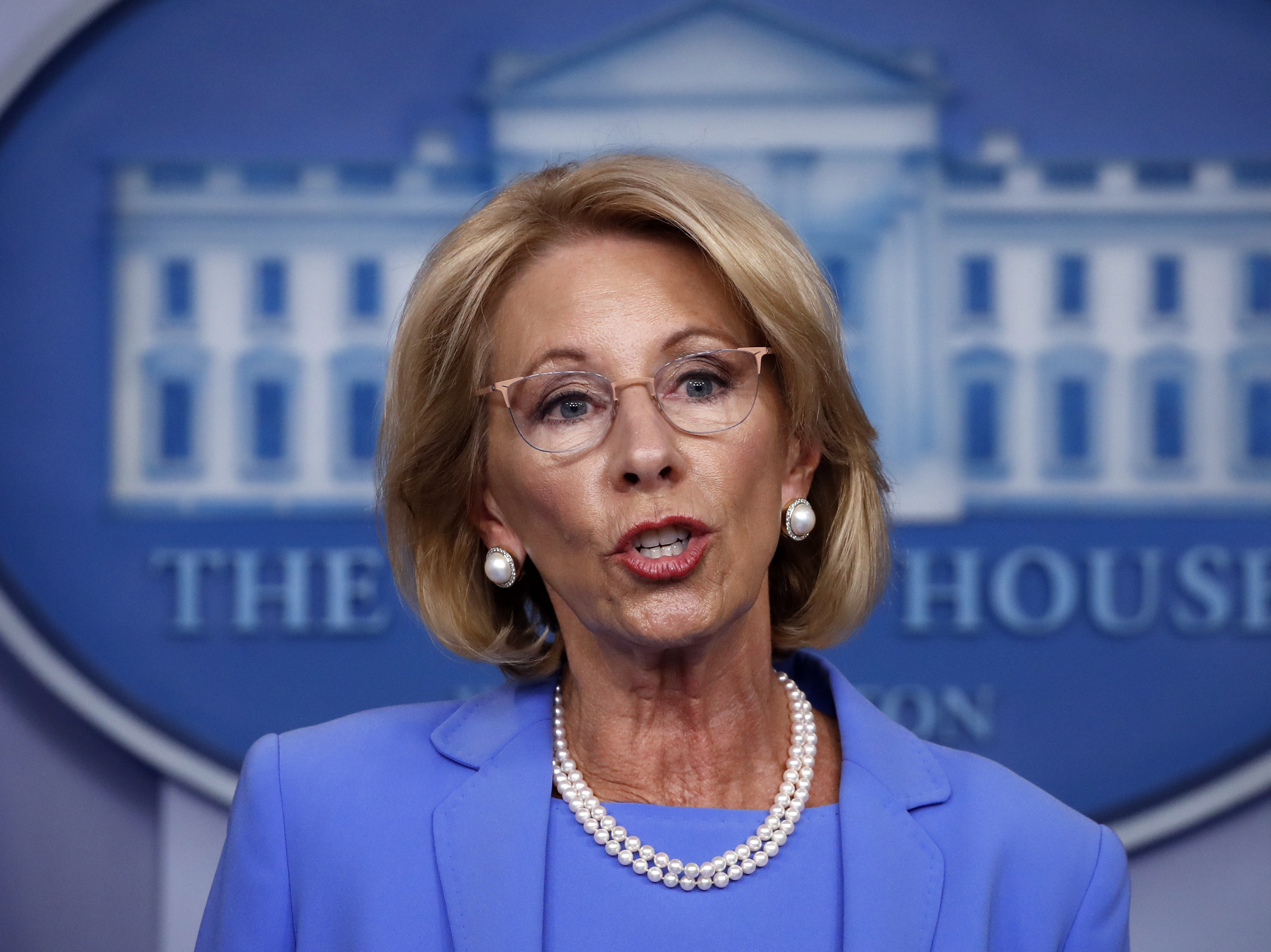 caption: Education Secretary Betsy DeVos speaks to reporters about the coronavirus at the White House in March.