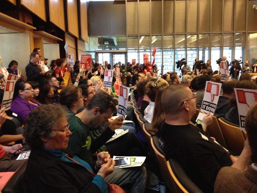 caption: Supporters of Mayor Murray's proposed $15 minimum wage packed a committee as council members discuss amendments to the plan. In the end, the committee unanimously passed the proposal.