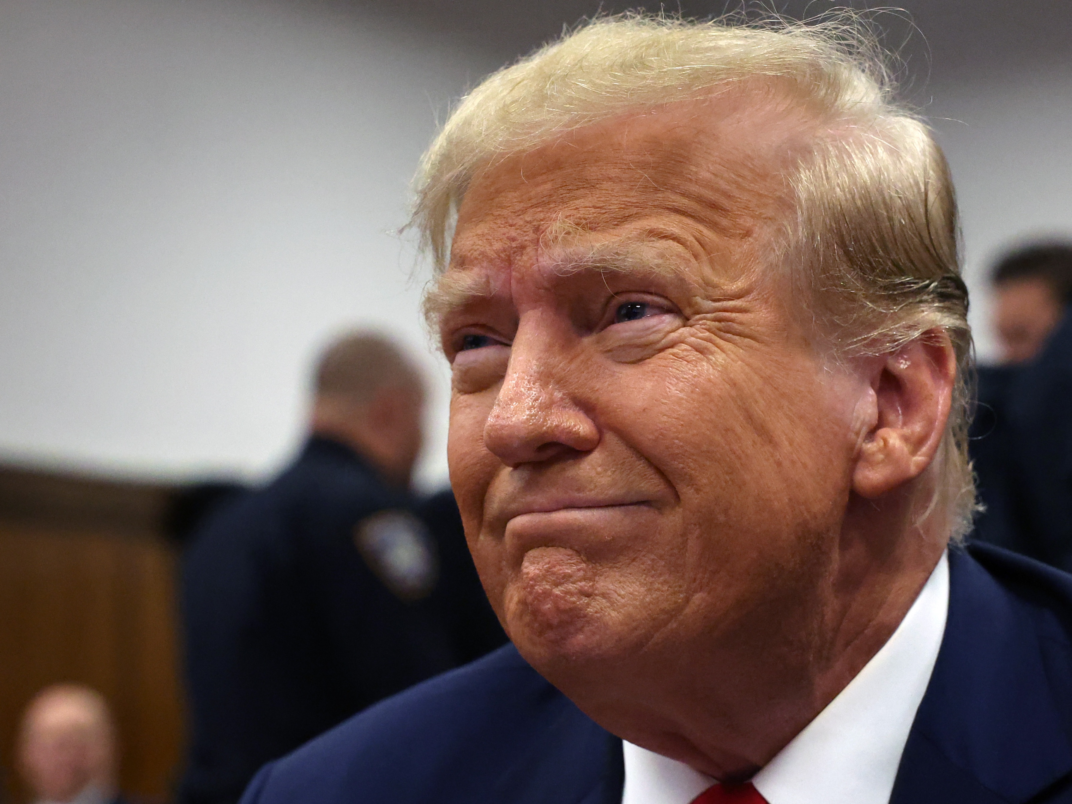 caption: Donald Trump sits in a Manhattan criminal courtroom with members of his legal team for the continuation of his hush money trial on April 25, 2024 in New York City.