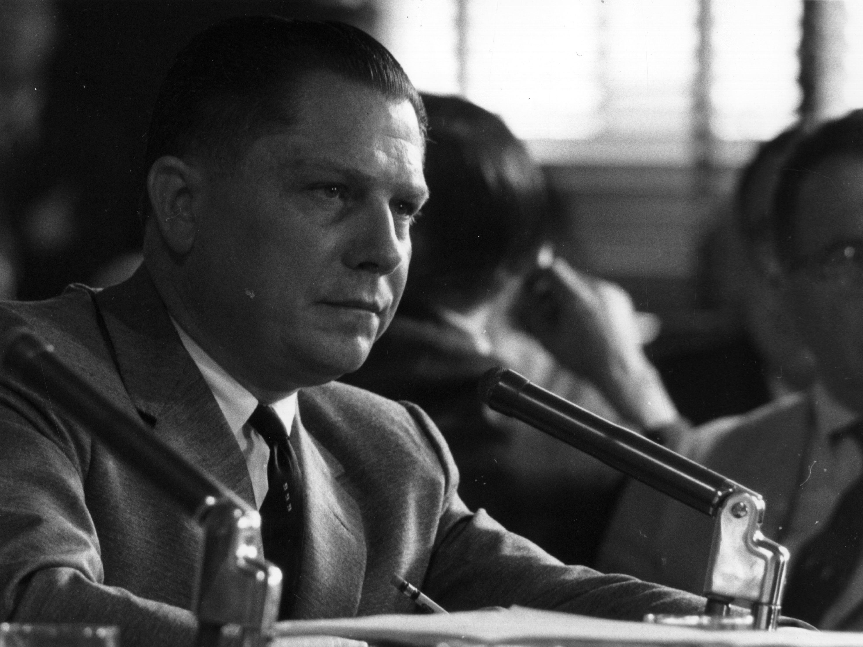 caption: In this photo from August 1958, American labor leader Jimmy Hoffa, president of the Teamsters union, testifies at a hearing investigating labor rackets. Hoffa disappeared in 1975, and no body has ever been found.
