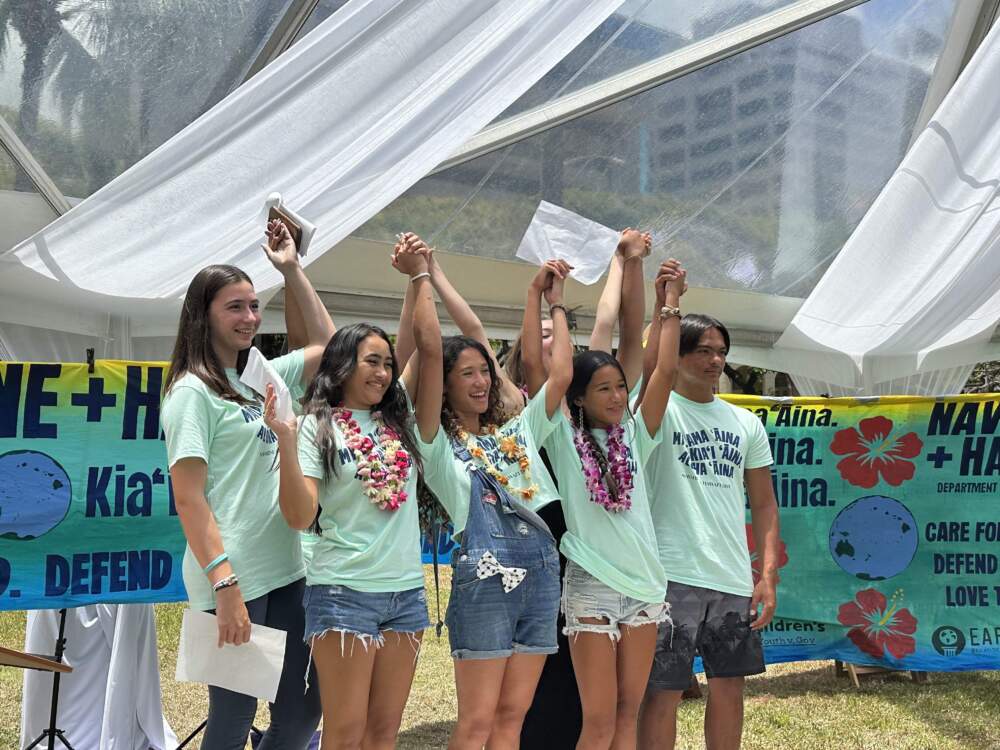 caption: Some of the youth who sued Hawaii's state Department of Transportation over its climate change policies celebrating a settlement in the case. (Courtesy of Our Children Trust)