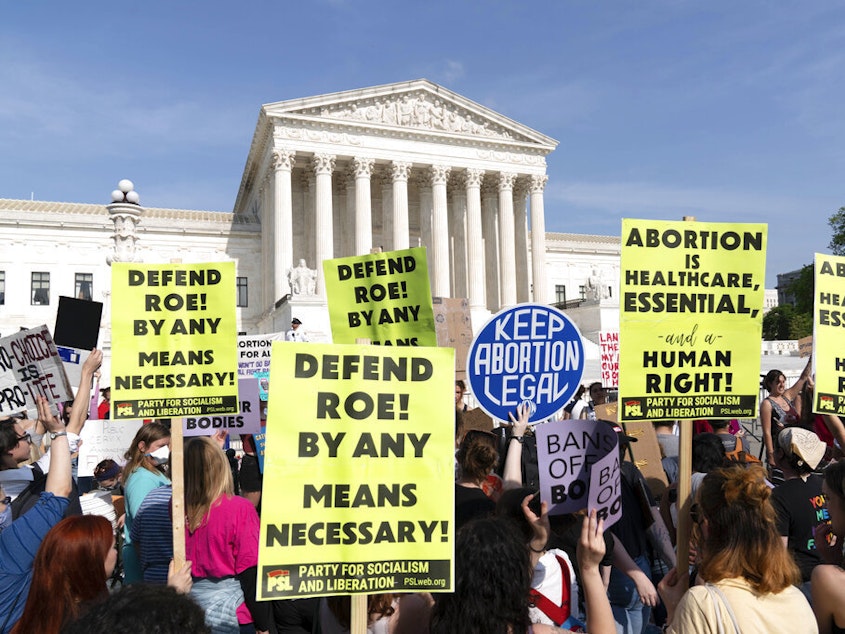 caption: Demonstrators protest outside of the U.S. Supreme Court Tuesday, May 3, 2022 in Washington.