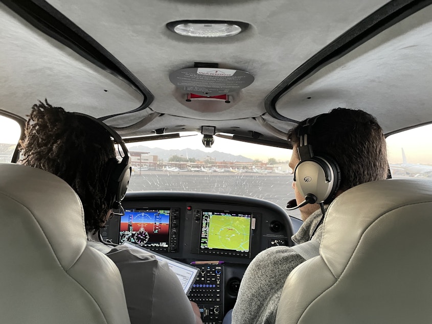 caption: A student pilot and flight instructor prepare to take off on a training flight outside of Phoenix.