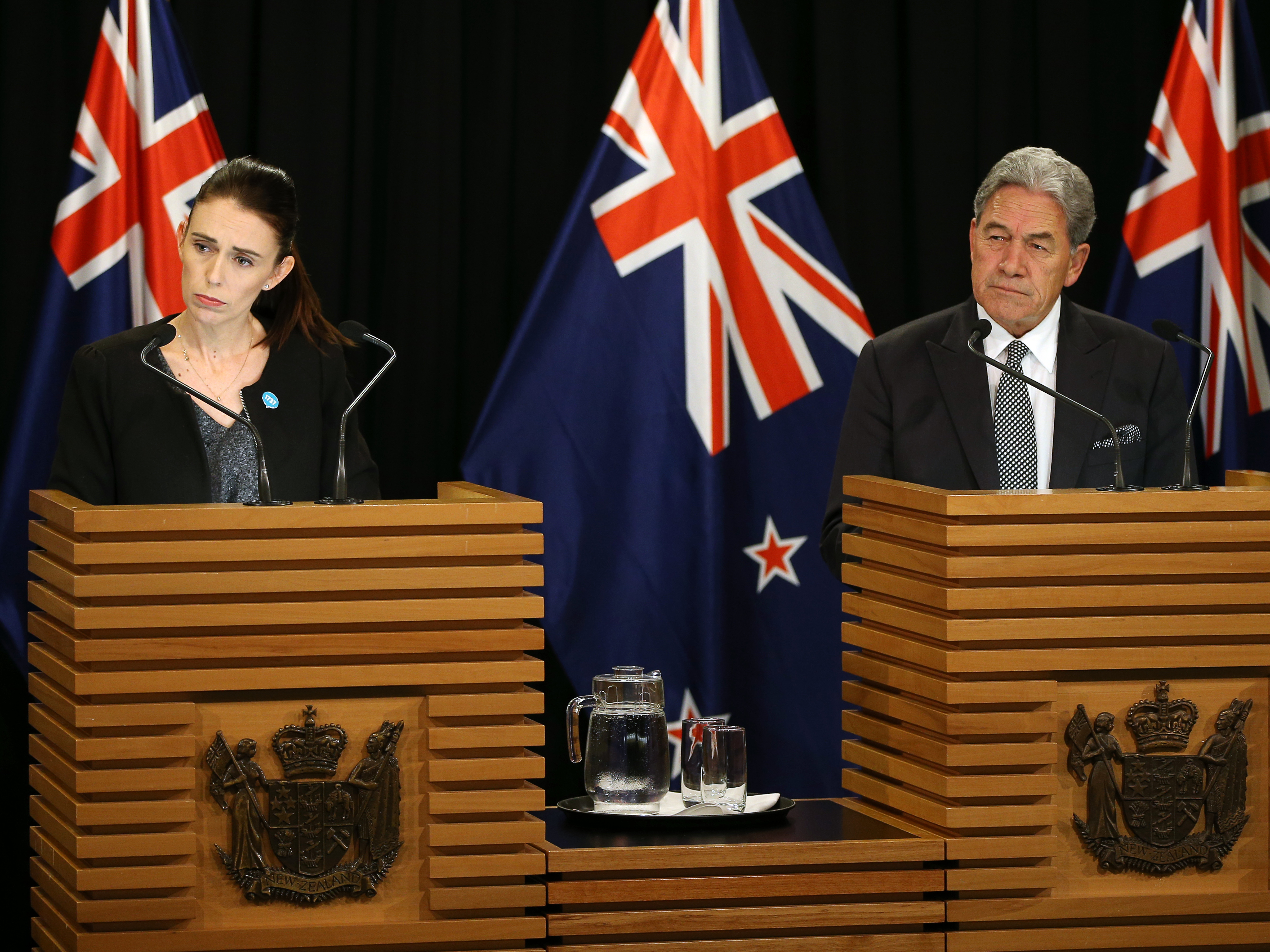 caption: Prime Minister Jacinda Ardern and Deputy Prime Minister Winston Peters speak to media during a press conference at Parliament on Monday.
