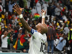 caption: Ghana's André Ayew celebrates after Mohammed Kudus scores the team's third goal in a 2022 World Cup Group H match against South Korea on Monday, Nov. 28, 2022, at the Education City Stadium in Al Rayyan, Qatar.