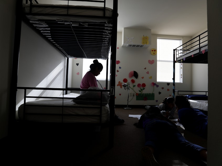 caption: When children are held for long periods away in detention centers, such as this center for migrant children in Carrizo Springs, Texas, they may suffer psychological harm.