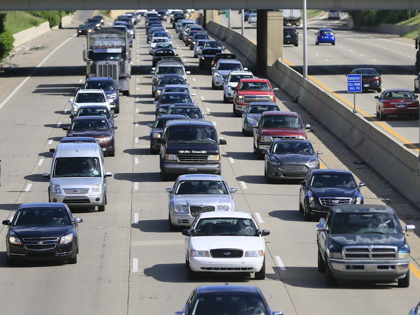 caption: Every car in Michigan that was covered by insurance as of the end of October will bring its owner $400, under a new refund plan approved by Gov. Gretchen Whitmer's administration.