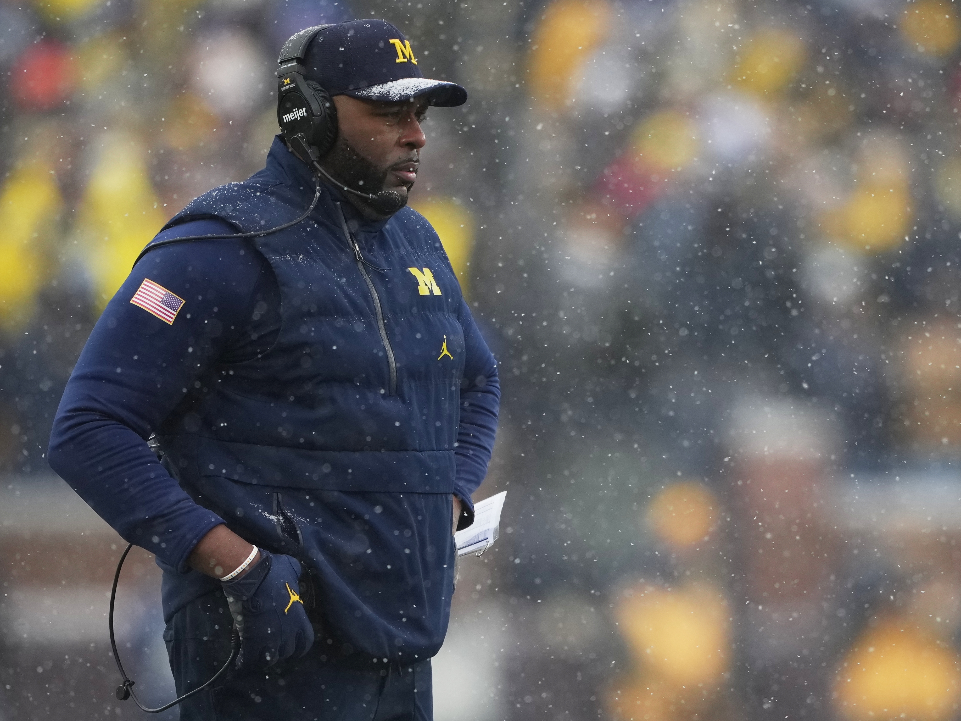 caption: Michigan head coach Sherrone Moore watches from the sideline during the second half of an NCAA college football game against Ohio State, Saturday, Nov. 29, 2025, in Ann Arbor, Mich.