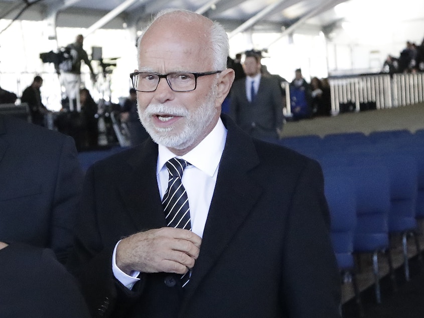 caption: Televangelist Jim Bakker, shown here in 2018, faces a legal challenge from the state of Missouri for selling a false remedy against the coronavirus. The COVID-19 disease currently has no cure.