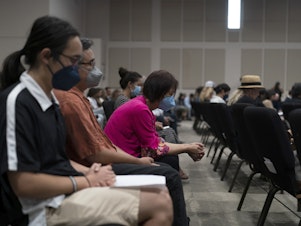 caption: People pray during a prayer vigil in Irvine, Calif., Monday, May 16, 2022. The vigil was held to honor victims in Sunday's shooting at Geneva Presbyterian Church in Laguna Woods, Calif.