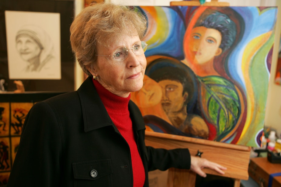 caption: Church abuse victim Mary Dispenza looks on in her studio with her artwork in the background in her Bellevue, Wash., home on Saturday, Dec. 2, 2006. 