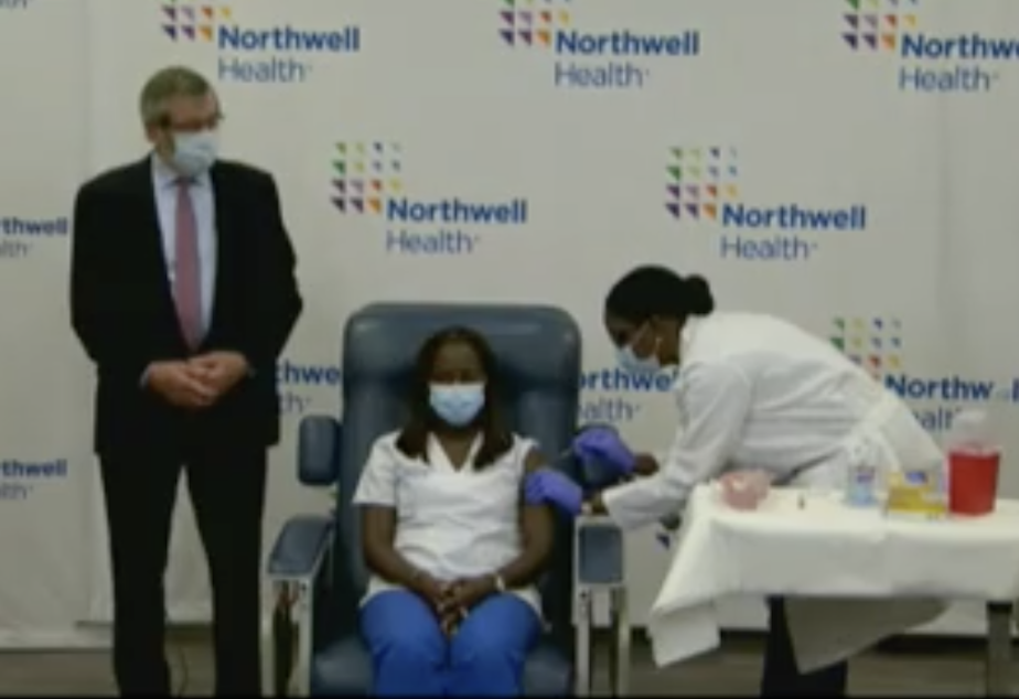 caption: A screenshot of the first widely publicized vaccination in the United States took place in Long Island, N.Y., shortly after 9 a.m. ET. The event was live streamed on Gov. Andrew Cuomo's Twitter account.