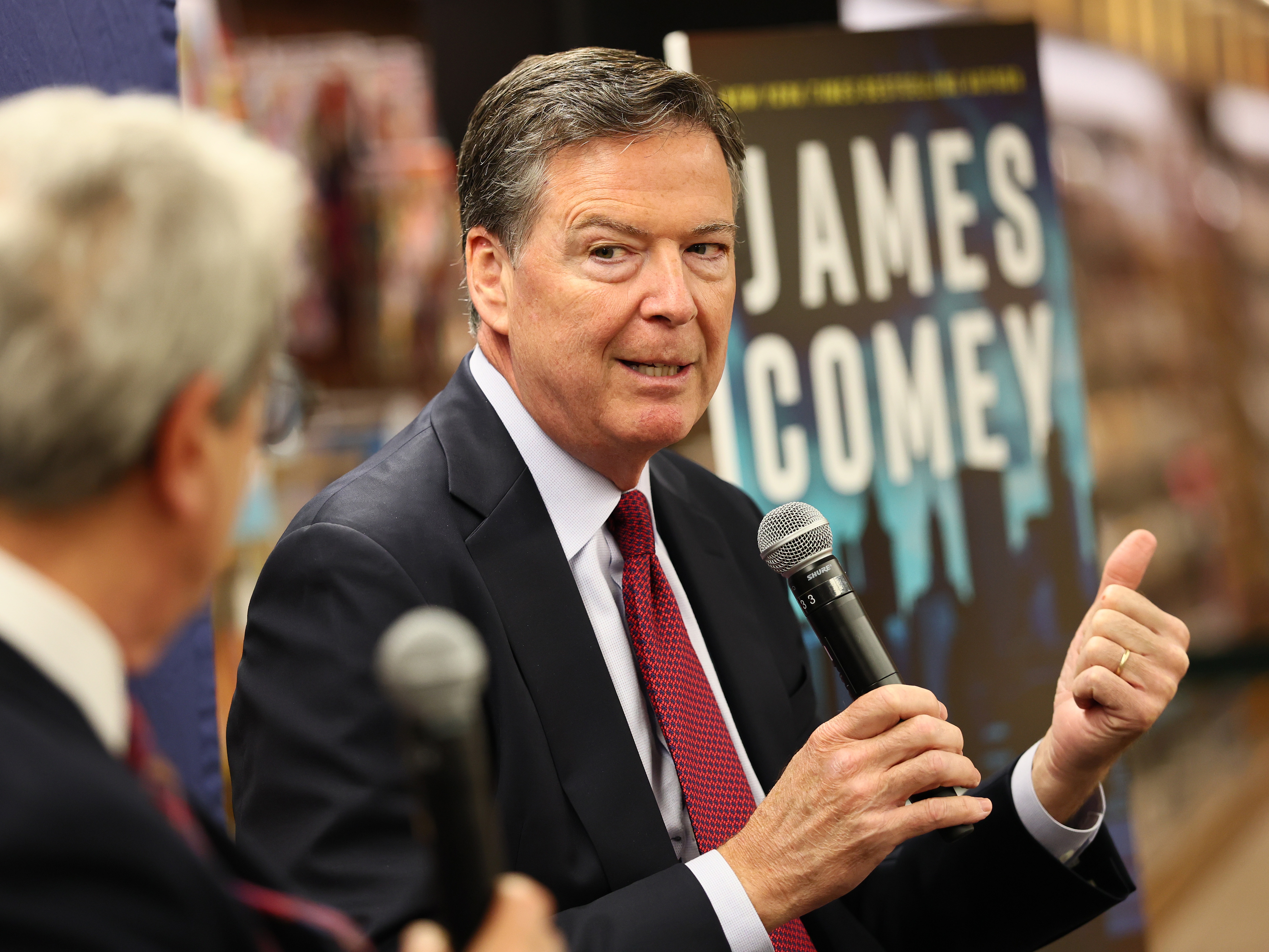 caption: James Comey, former FBI director, speaks at a book event in New York City in May 2025. He was arraigned on federal charges on Wednesday.