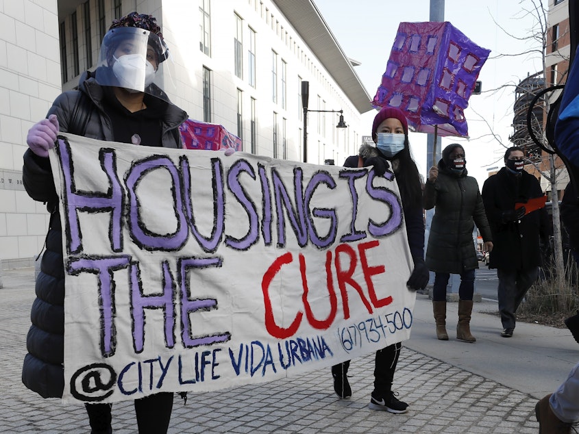 caption: Tenants' rights advocates protesting evictions during the pandemic in Boston this month. They want the Biden administration to not only extend, but also strengthen, an eviction order from the CDC aimed at keeping people in their homes during the outbreak.