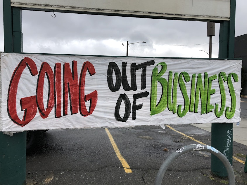 caption: The sign outside MacPherson's Fruit and Produce on Seattle's Beacon Hill.