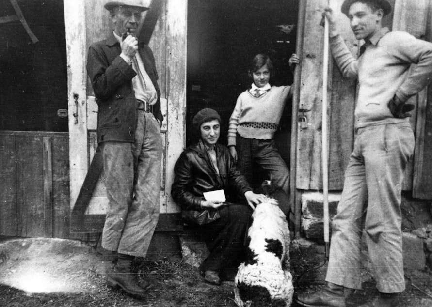 caption: Estella Leopold, center, and, left to right, her father Aldo, mother Estella, and brother Starker at the Leopold family shack near Baraboo, Wisconsin, in 1938
