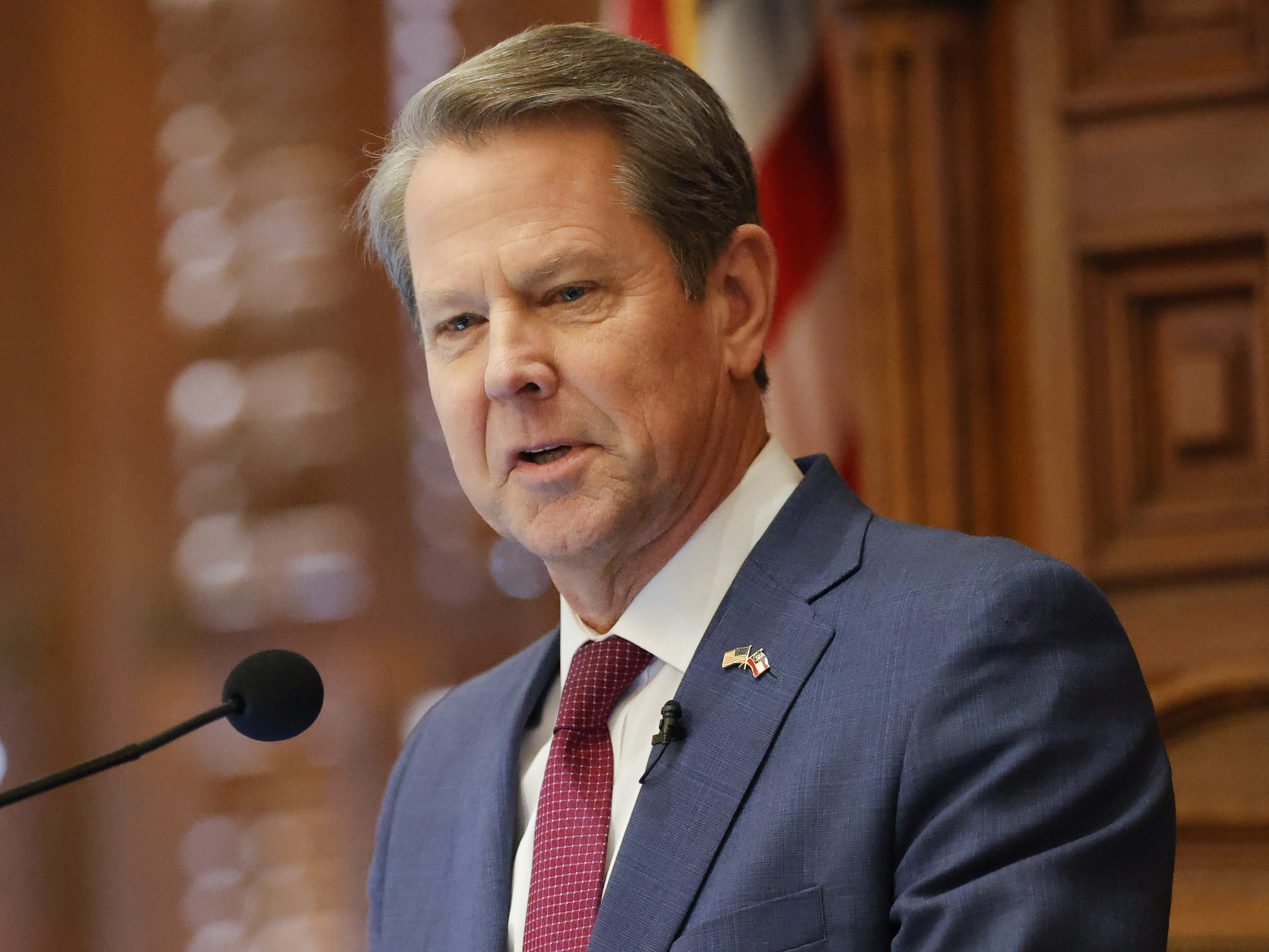 caption: Georgia Gov. Brian Kemp, seen delivering the State of the State address on Jan. 25, has signed a bill that would ban most gender-affirming surgeries and hormone replacement therapies for transgender people under 18.