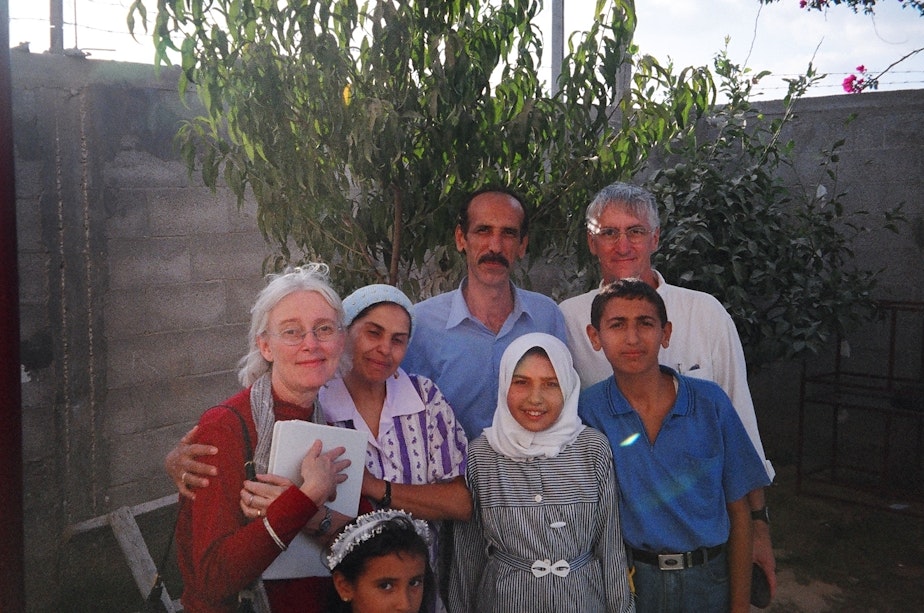 caption: Cindy and Craig Corrie with members of the Nasrallah family, who lived in the house their daughter Rachel Corrie stood in front of to prevent it from being demolished in 2003.