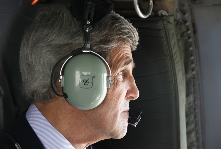 caption: FILE: Secretary John Kerry looks out over the city of Kabul from a helicopter after departing the U.S. Embassy on Tuesday, March 26, 2013.