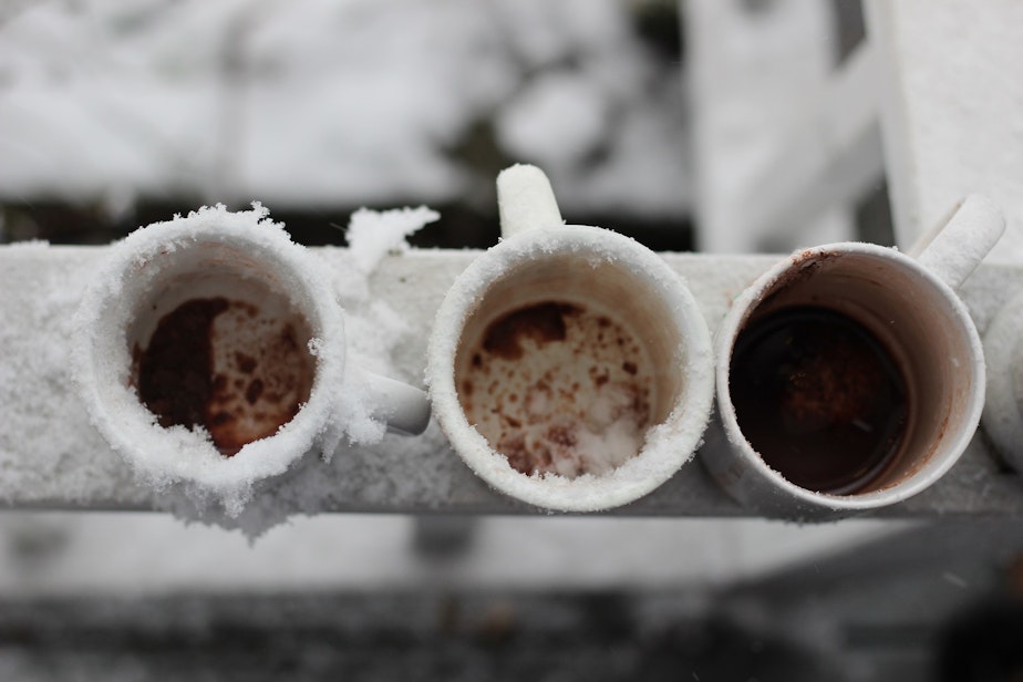 caption: Three cups of cocoa on a porch in Greenwood.