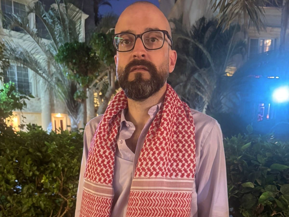 caption: Bassem Khandaqji, 41, poses for a photo at a hotel in Cairo on Oct. 17, 2025, days after Israel freed him and other Palestinian prisoners in the Gaza ceasefire deal. He was imprisoned for helping plan a deadly 2004 bombing in Tel Aviv, and went on to become an award-winning novelist in prison.