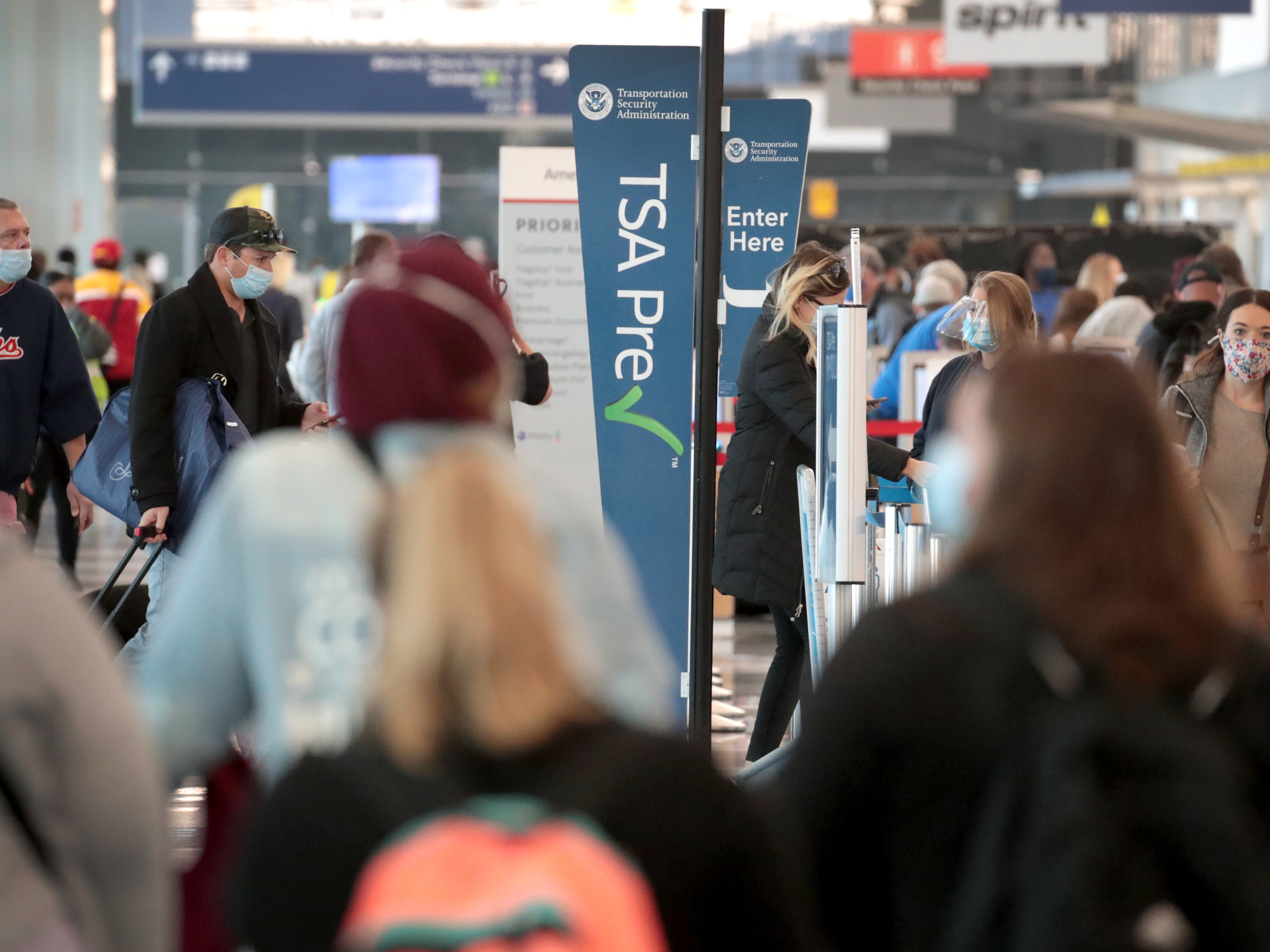 caption: Passengers enter a checkpoint at O'Hare International Airport on Monday. The TSA reports it screened over 1 million passengers on Sunday, the highest number since the coronavirus crisis began.