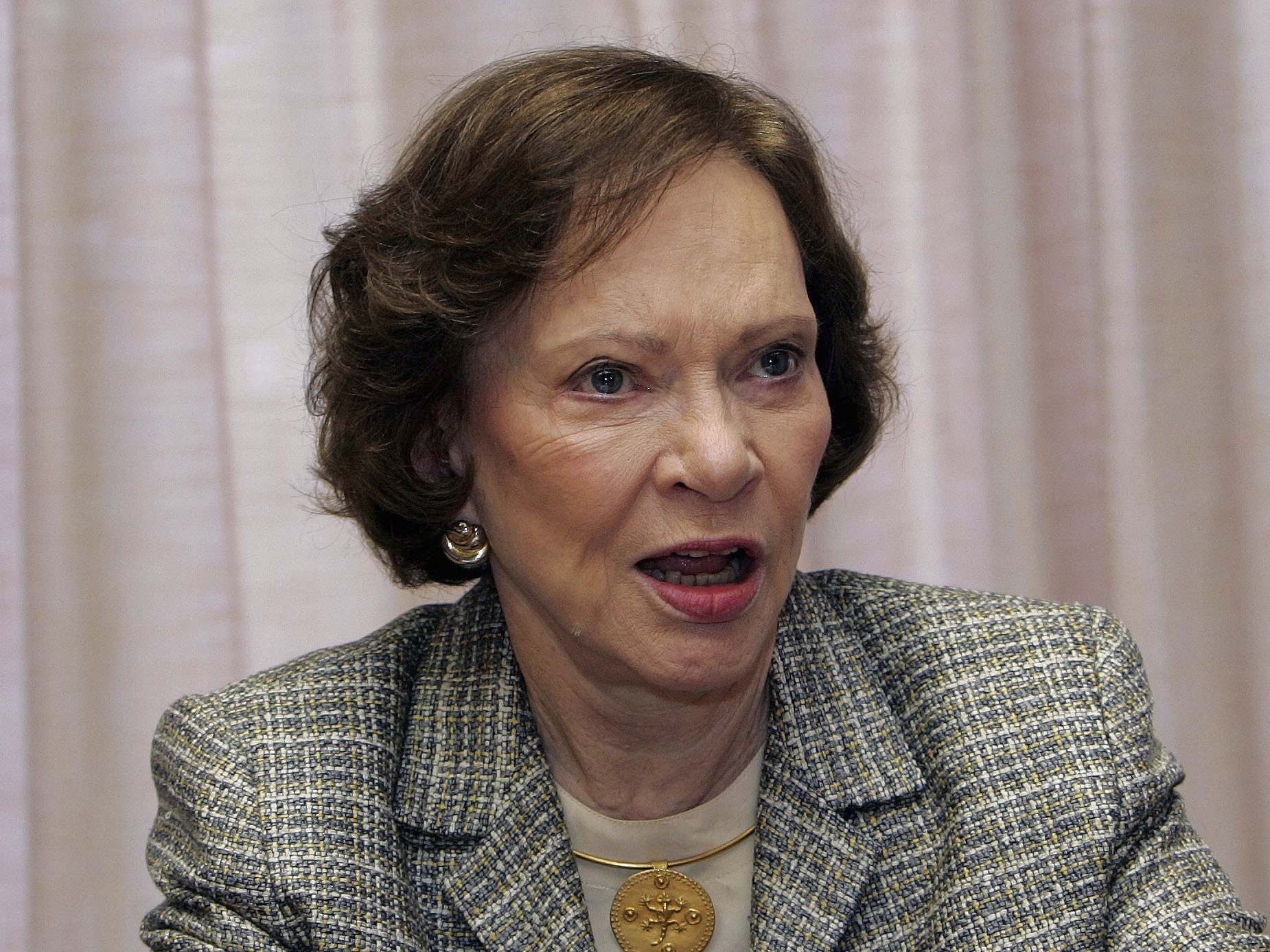 caption: Former first lady Rosalynn Carter discusses a report on mental health and addiction during the 21st annual Rosalynn Carter Symposium on Mental Health Policy at the Carter Center, Nov. 3, 2005, in Atlanta. The advocacy of Carter, who died Nov. 19 at age 96, created a framework for much of the progress on mental illness in America.