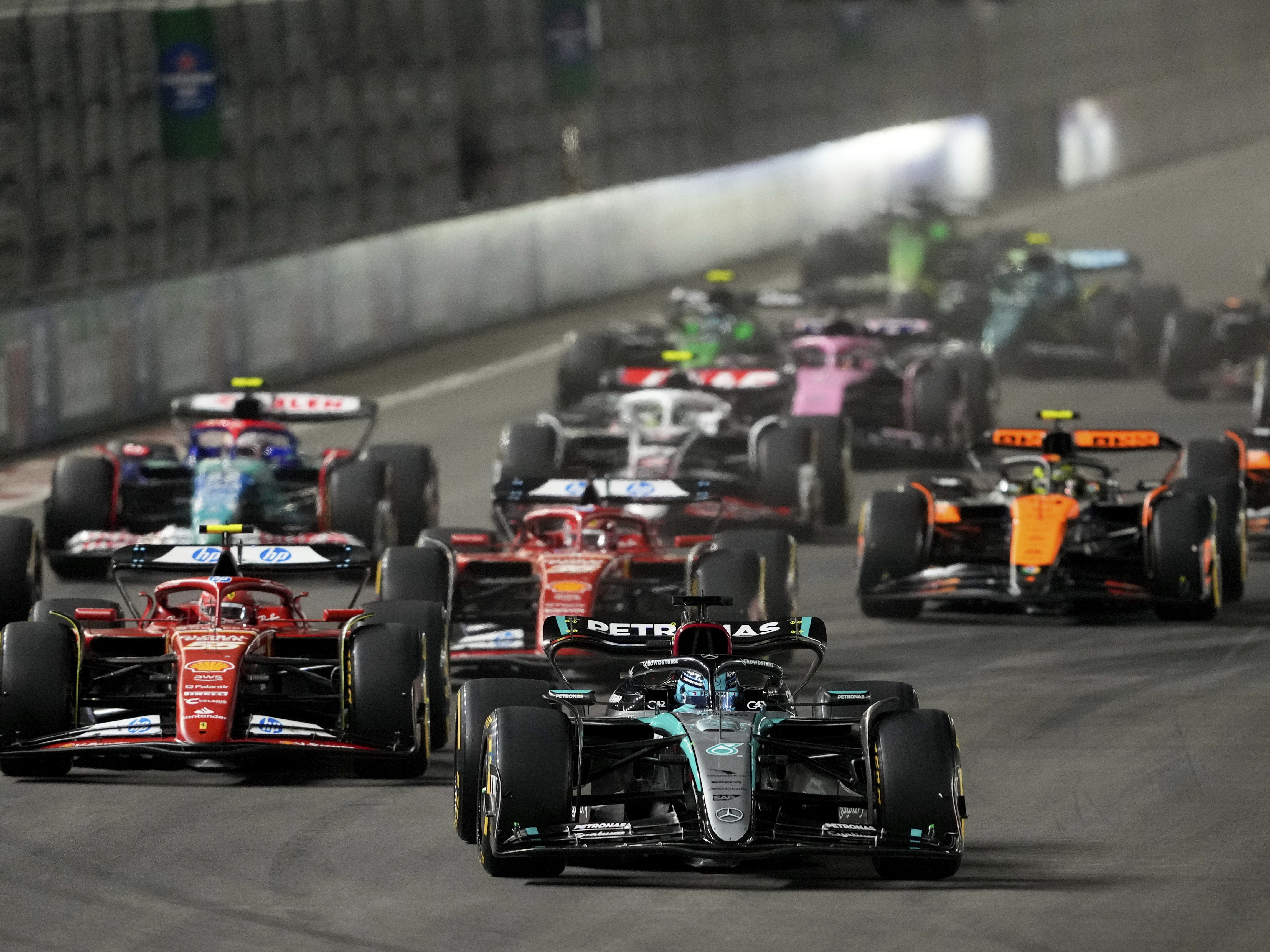 caption: Mercedes driver George Russell, of Britain, leads the field during the F1 Las Vegas Grand Prix auto race, Sunday, Nov. 24, 2024, in Las Vegas.