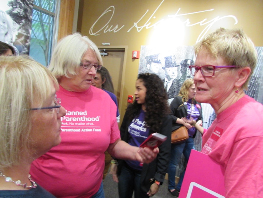 caption: Sen. Patty Murray (left) speaks with Planned Parenthood volunteer Barbara Culp (right). 