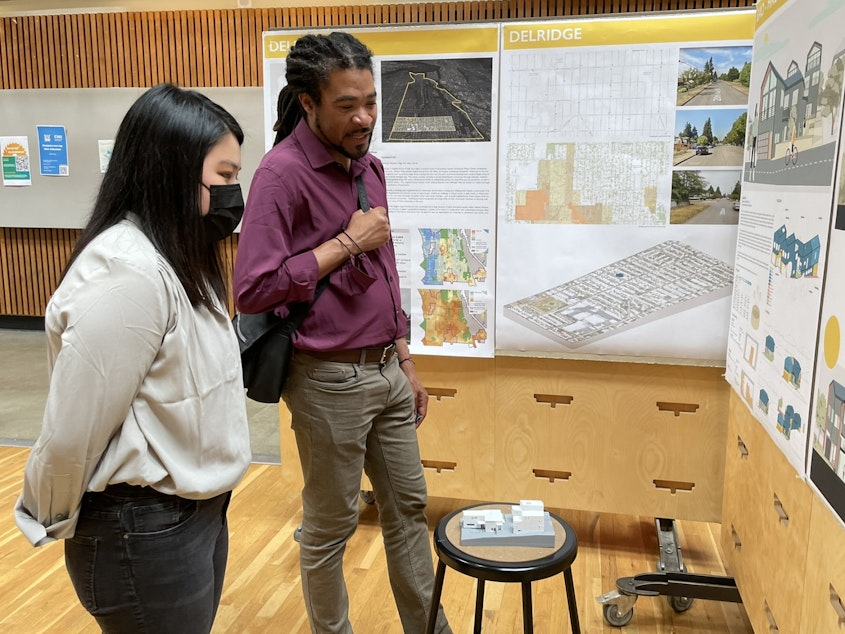 caption: UW Architecture student Miggi Wu discusses her "Bao House" project with Rico Quirindongo, acting director of Seattle's Office of Planning and Community Development on June 6, 2022.