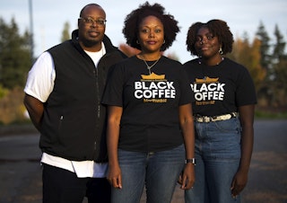 caption: From left, Erwin Weary Sr., Darnesha Weary and Mikayla Weary stand for a portrait on Thursday, October 15, 2020, outside of their new business, Black Coffee Northwest, along Aurora Avenue North in Shoreline.