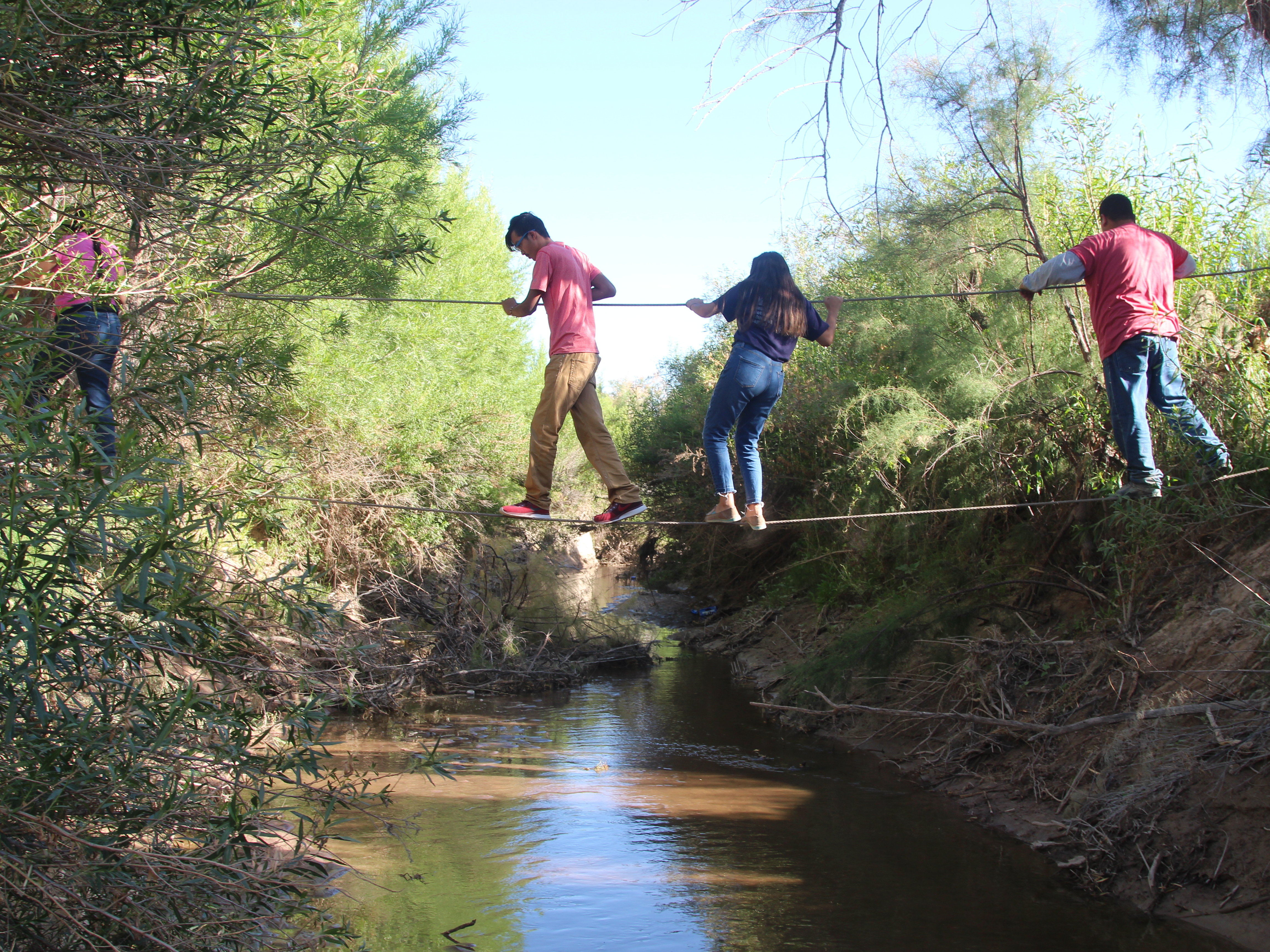caption: U.S. citizens use ropes to cross the Rio Grande from San Antonio del Bravo, Mexico, into Candelaria, Texas. U.S. citizens depend on the free health clinic in San Antonio del Bravo.