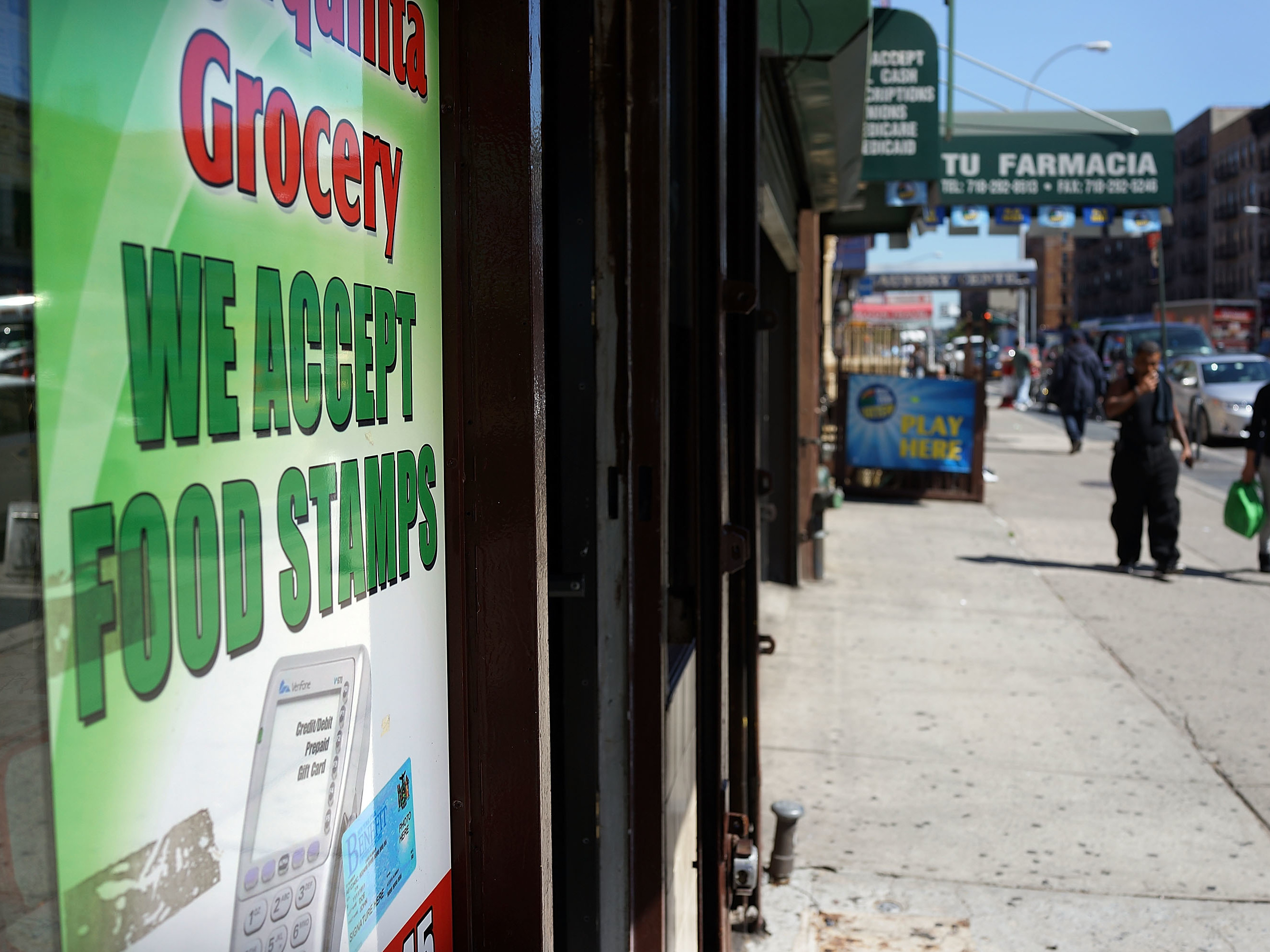 caption: A grocery store in New York City advertises that it accepts food stamps. A Trump administration proposal could result in 3 million people losing their food assistance.