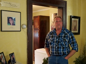 caption: Ernie Haynes stands next to a memorial for his daughter, Jennifer, at his home in Risingsun, Ohio. Following her drug overdose death in 2017, he was charged with abduction after trying to gain custody of his grandchildren. The action sparked a five-year legal battle to clear his name.