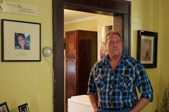 caption: Ernie Haynes stands next to a memorial for his daughter, Jennifer, at his home in Risingsun, Ohio. Following her drug overdose death in 2017, he was charged with abduction after trying to gain custody of his grandchildren. The action sparked a five-year legal battle to clear his name.