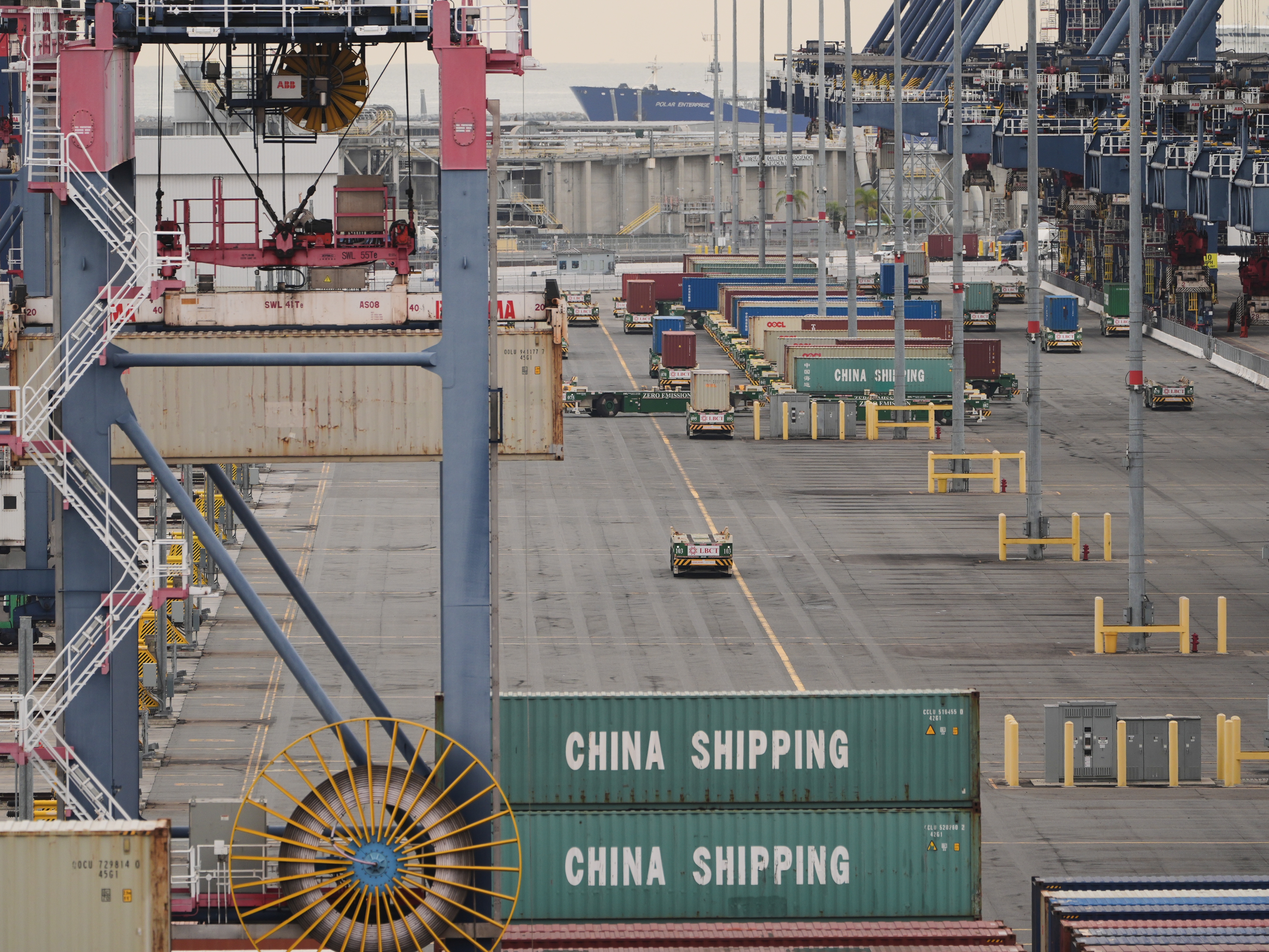 caption: Containers are stacked at the Port of Long Beach Friday, Feb. 20, 2026, in Long Beach, Calif.