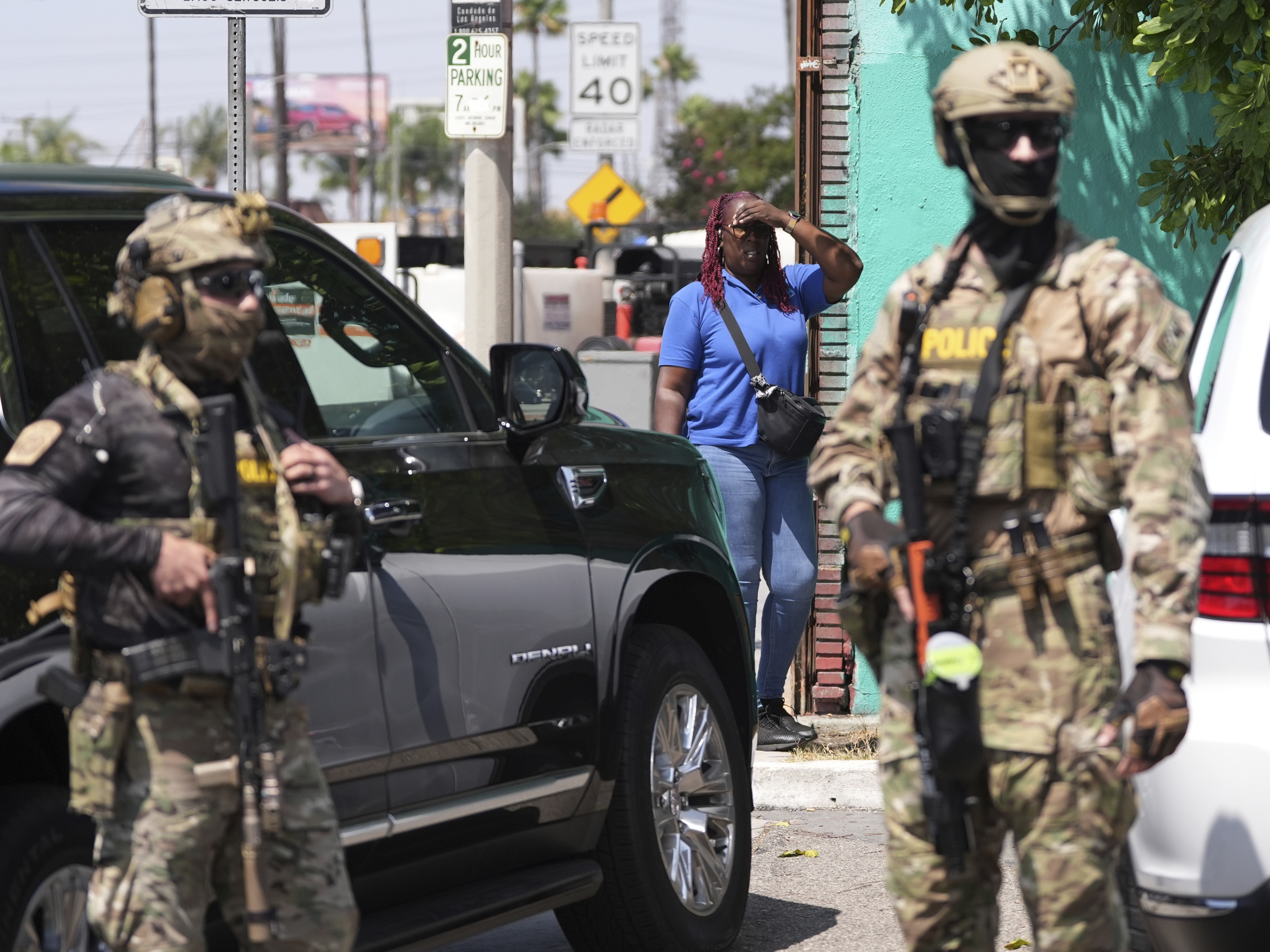 caption: An immigration raid at a car wash in California in August.