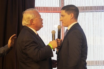 caption: Ohio Republican U.S. Senate candidates Mike Gibbons (left) and Josh Mandel exchange heated words at a forum put on by FreedomWorks on March 18 outside of Columbus. The two have polled atop the contested GOP primary.