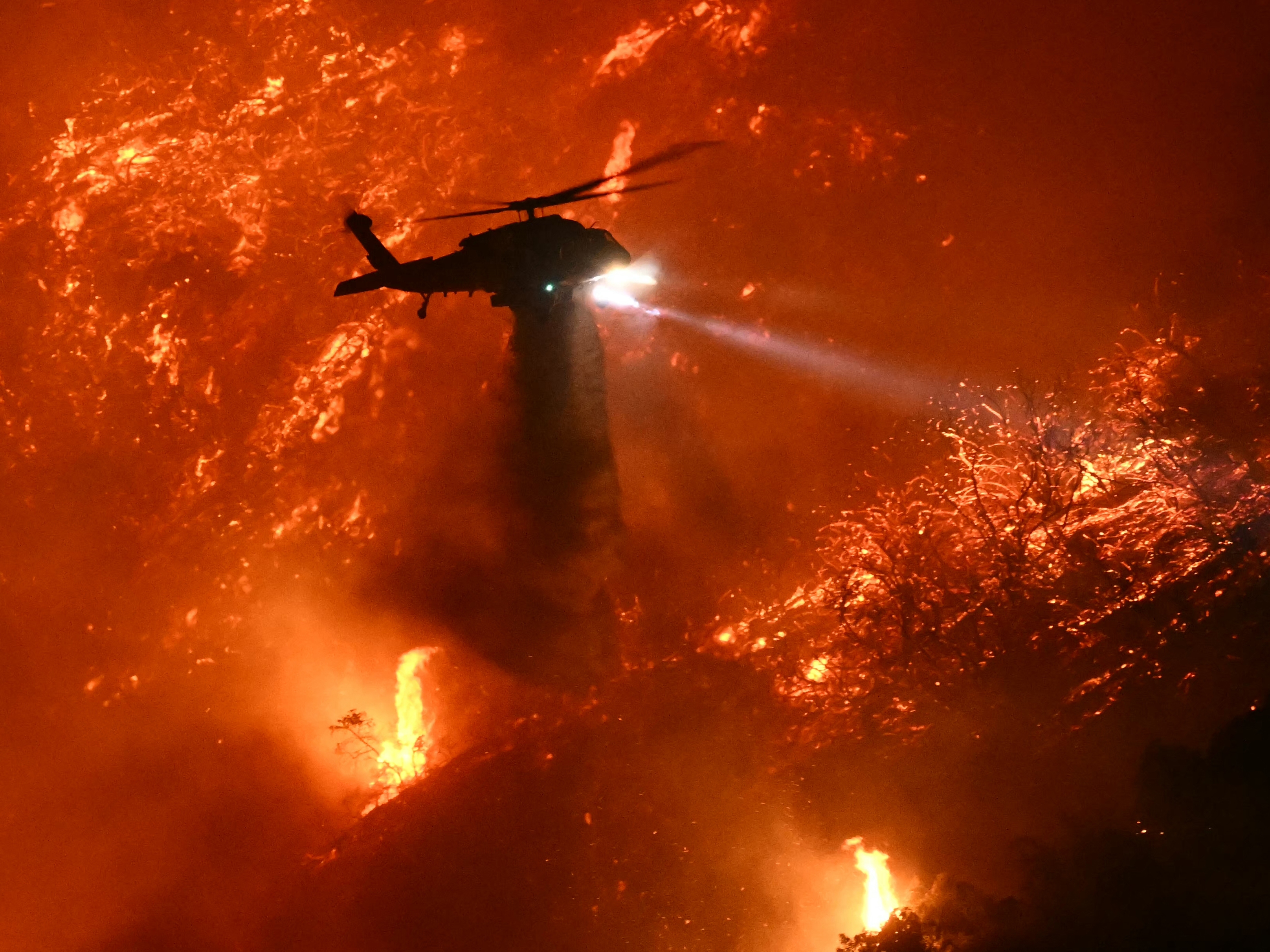 caption: High winds and dry vegetation set the stage for the explosive wildfires in Los Angeles. Scientists are finding that climate change fueled some of the extreme conditions.