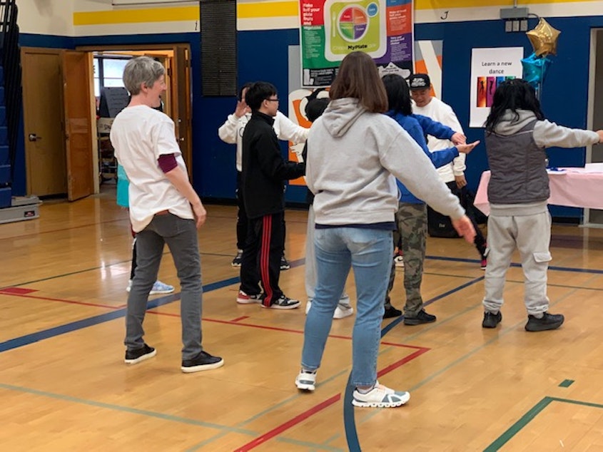 caption: Students and community members take part in a Move-A-Thon event March 10 at Aki Kurose Middle School to raise money for schools in Seattle's District 7. 