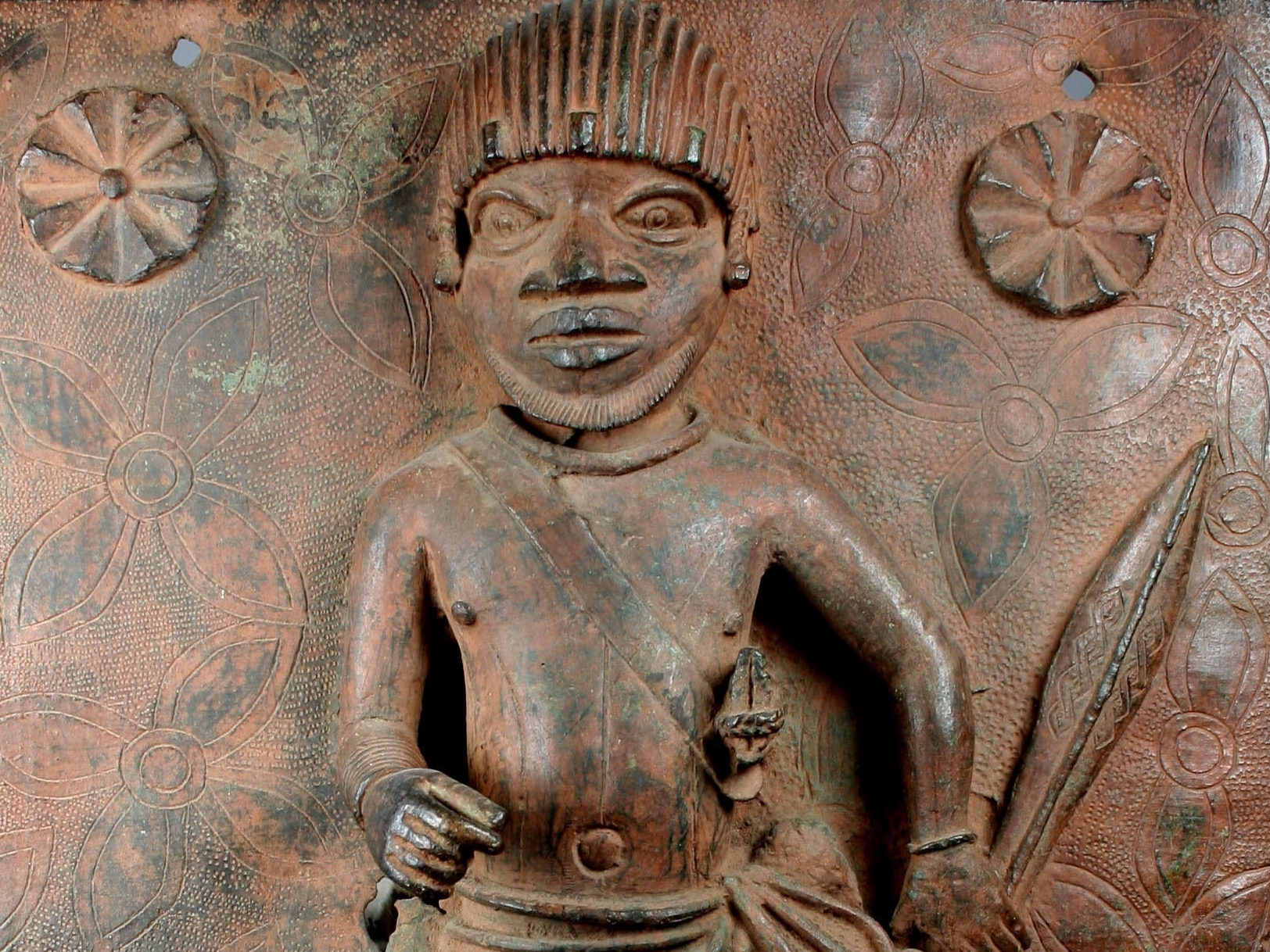 caption: <em>Junior Court Official</em> is one of two 16th-century plaques produced at the Court of Benin that will be returned to Nigeria by the Met.