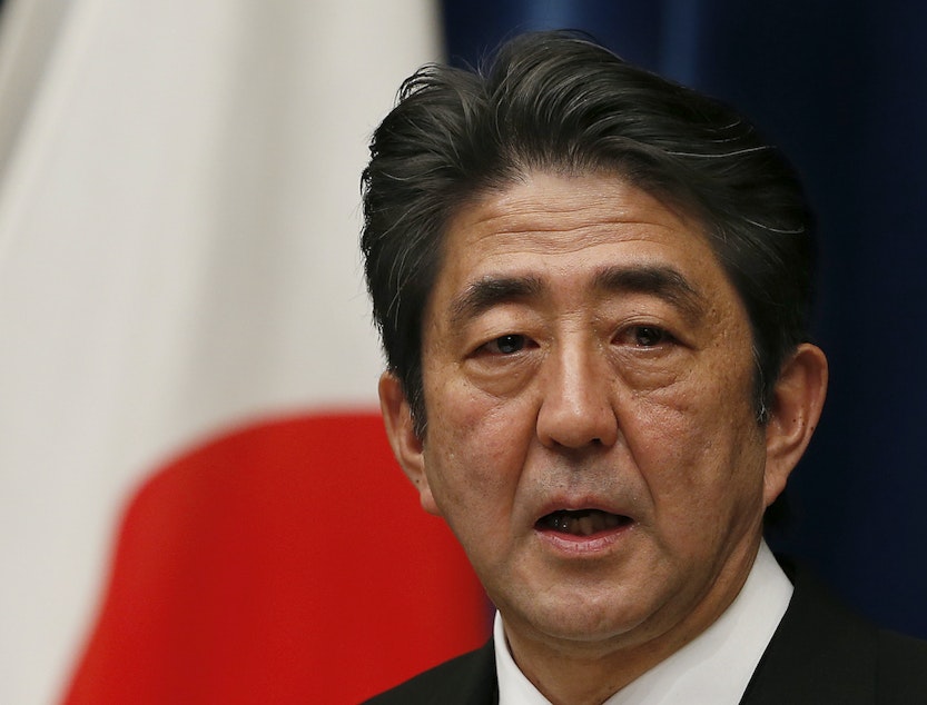 caption: Then Japan's new Prime Minister Shinzo Abe speaks during his first press conference at the prime minister's official residence in Tokyo Wednesday, Dec. 26, 2012.