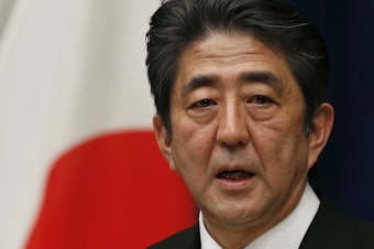caption: Then Japan's new Prime Minister Shinzo Abe speaks during his first press conference at the prime minister's official residence in Tokyo Wednesday, Dec. 26, 2012.
