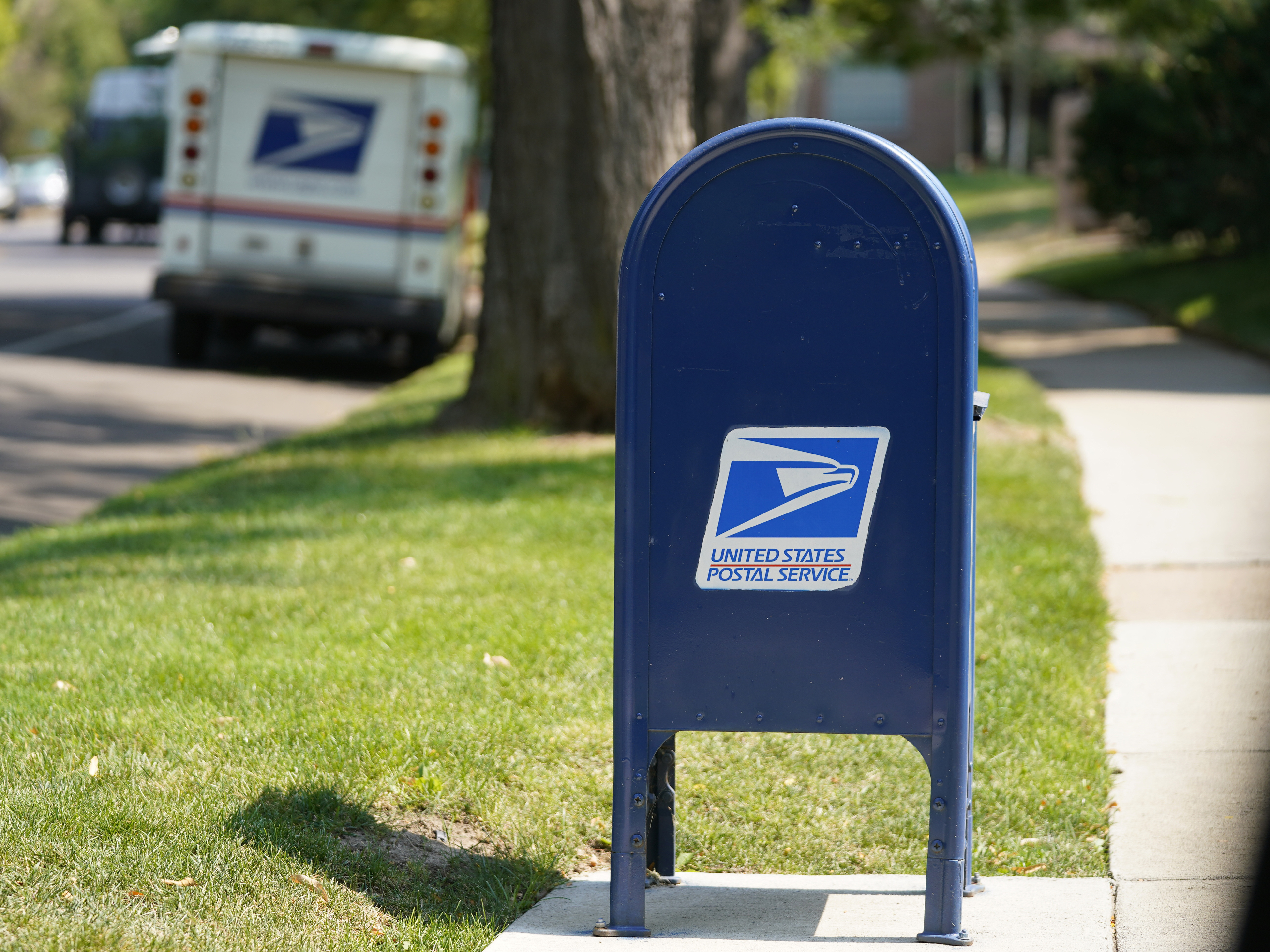 caption: A United States Postal Service mailbox stands along Bonnie Brae Boulevard Monday, Aug. 17, 2020, in southeast Denver.