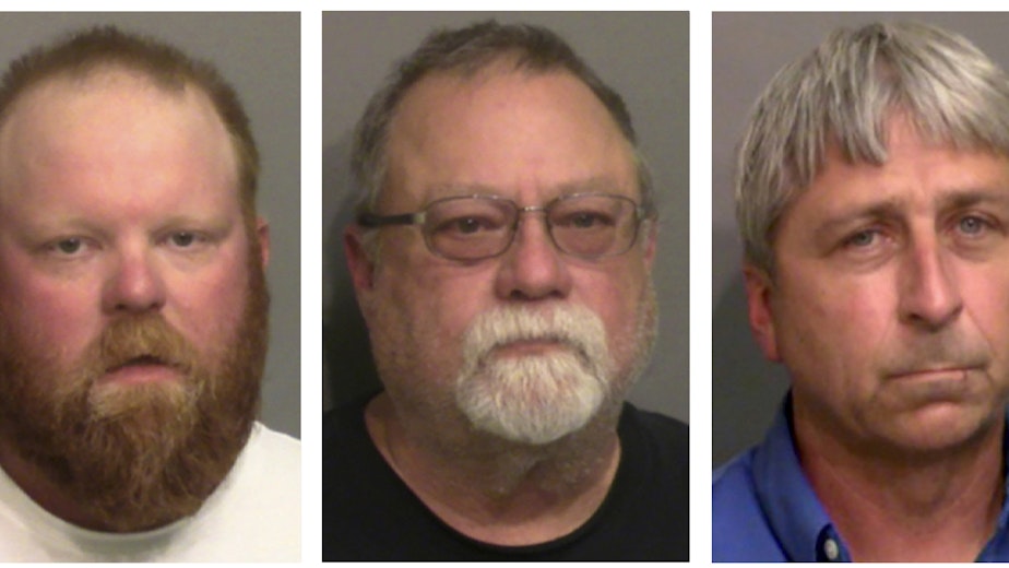 caption: Federal prosecutors are arguing that, from left, Travis McMichael, his father Gregory McMichael, and William "Roddie" Bryan Jr. are guilty of a hate crime in the death of Ahmaud Arbery, whose murder they were convicted of in state court.