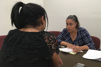 caption: Attorney Linda Rivas with the nonprofit Las Americas of El Paso meets with transgender migrant woman sent back to Mexico as part of the Trump administration's "Remain in Mexico" policy.