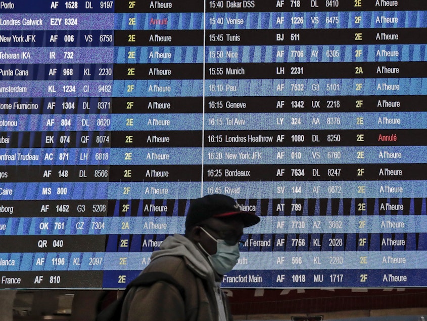 caption: Vaccinated travelers will be allowed to fly to the U.S. starting in early November